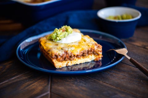 tex mex casserole slice on blue plate