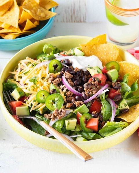 easy taco salad with jalapenos and chips in bowl