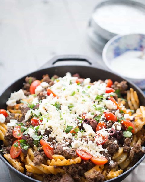 greek fries in cast iron skillet with feta