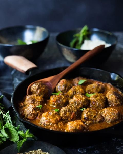 lamb meatballs with indian curry  in skillet