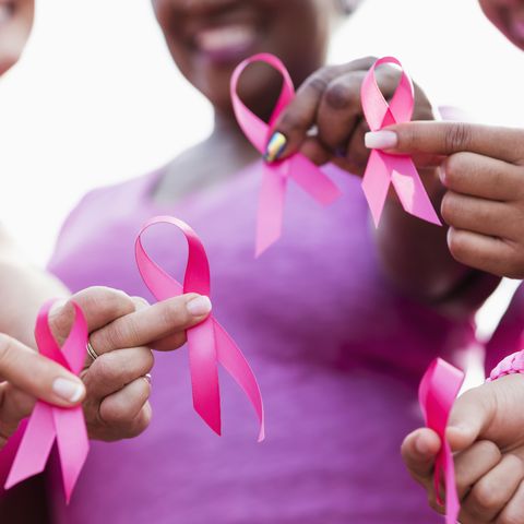 Group of women in pink, breast cancer awareness ribbons