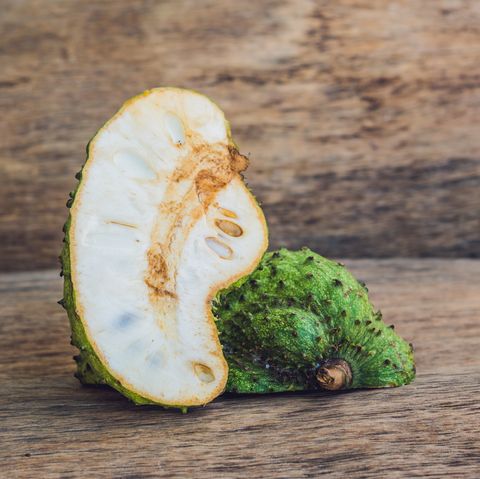 Guanabana on an old wooden background - exotic tropical fruit - regional fruits from Vietnam