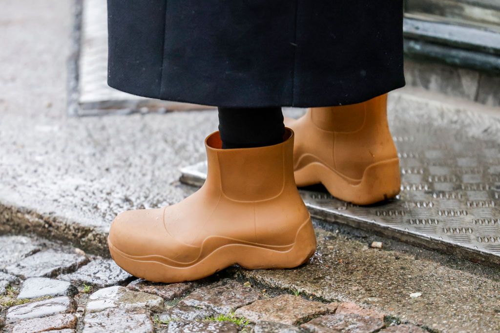 guest wearing brown rubber boots by bottega veneta seen news photo 1658799311