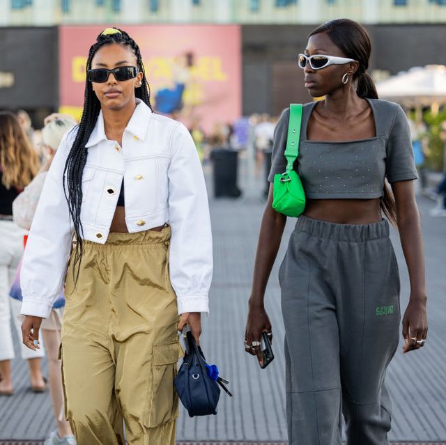 two women walk at copenhagen fashion week wearing casual outfits by ganni to illustrate a roundup of casual outfit ideas 2022