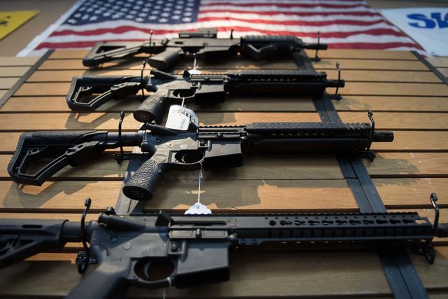 assault rifles hang on the wall for sale at blue ridge arsenal in chantilly, virginia, on october 6, 2017  afp photo  jim watson        photo credit should read jim watsonafp via getty images