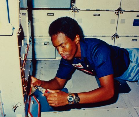 guy bluford checks out the sample pump on the continuous flow electrophoresis system on the challenger shuttle in 1983
