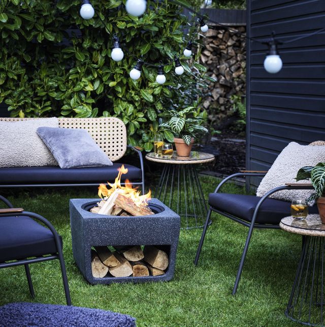 winter garden with fire pit, chairs and cosy blankets