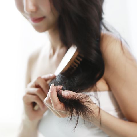 Woman brushing hair