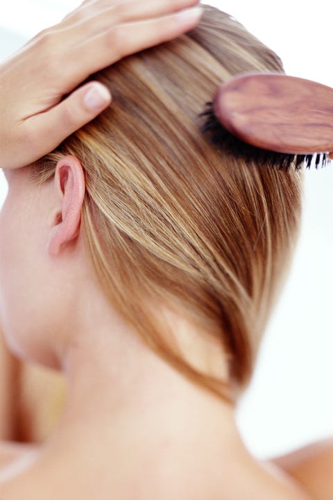 woman brushing her hair