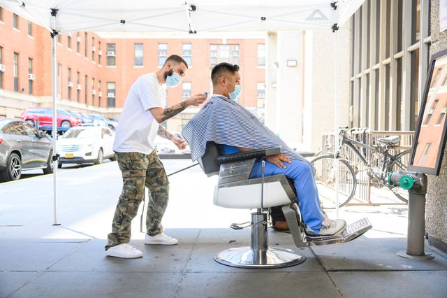 medical workers receive haircuts from volunteer stylists outside bellevue hospital in manhattan