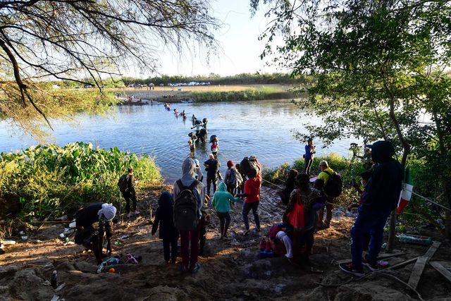 haitian migrants cross the rio grande river as seen from ciudad acuna, coahuila state, mexico, on september 23, 2021   tension reigns this thursday in a haitian migrant camp in ciudad acuña on the border with the united states, after the arrival of dozens of mexican police officers photo by pedro pardo  afp photo by pedro pardoafp via getty images