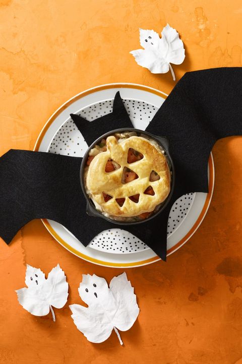 roasted chicken pot pies with a jack o lantern puff pastry on top