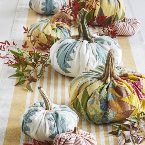 fabric pumpkins on table