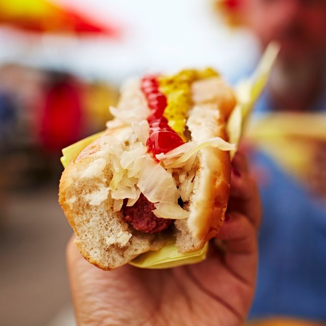 hand holding hotdog