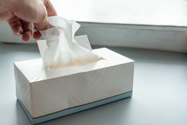 how long is flu contagious  hand picking white tissue paper