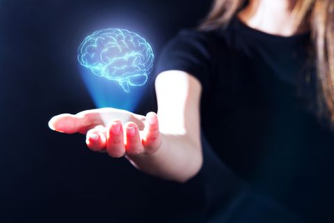 hand showing a brain hologram