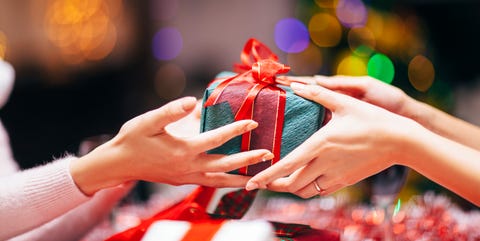Hands Giving Gift Close Up Hands Giving Gift Close Up