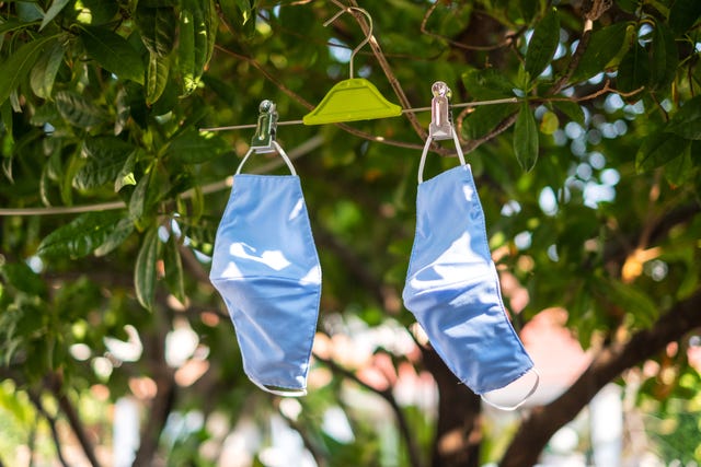 hanging and drying fabric face masks in the sun