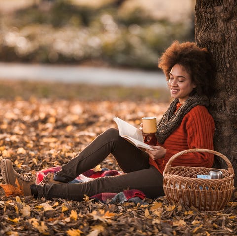 Fall Captions Inspired by Quotes woman reading fall quotes