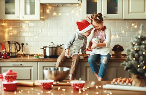 christmas card ideas happy children boy and girl bake christmas cookies