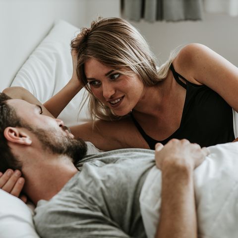 romantic moment happy couple in love in the bed   stock image