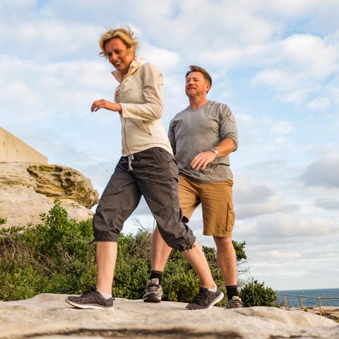 Happy Middle Aged Active Fit Healthy Beach Couple Hiking Outdoors Happy Middle Aged Active Fit Healthy Beach Couple Hiking Outdoors
