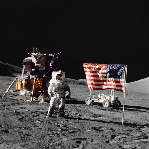 harrison h schmitt, pilot of the lunar module, stands on the lunar surface near the united states flag during nasa's final lunar landing mission in the apollo series 13 december 1972 credit nasa science astronaut space travel