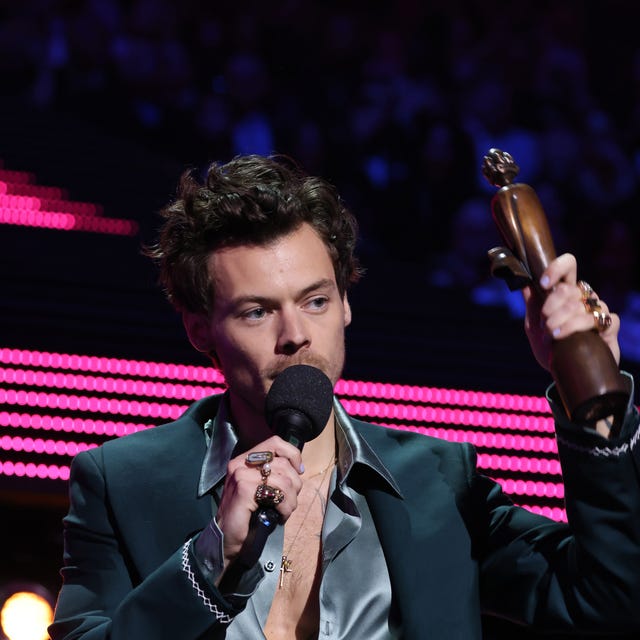 Harry Styles harry styles accepts an award at the brit awards 2023
