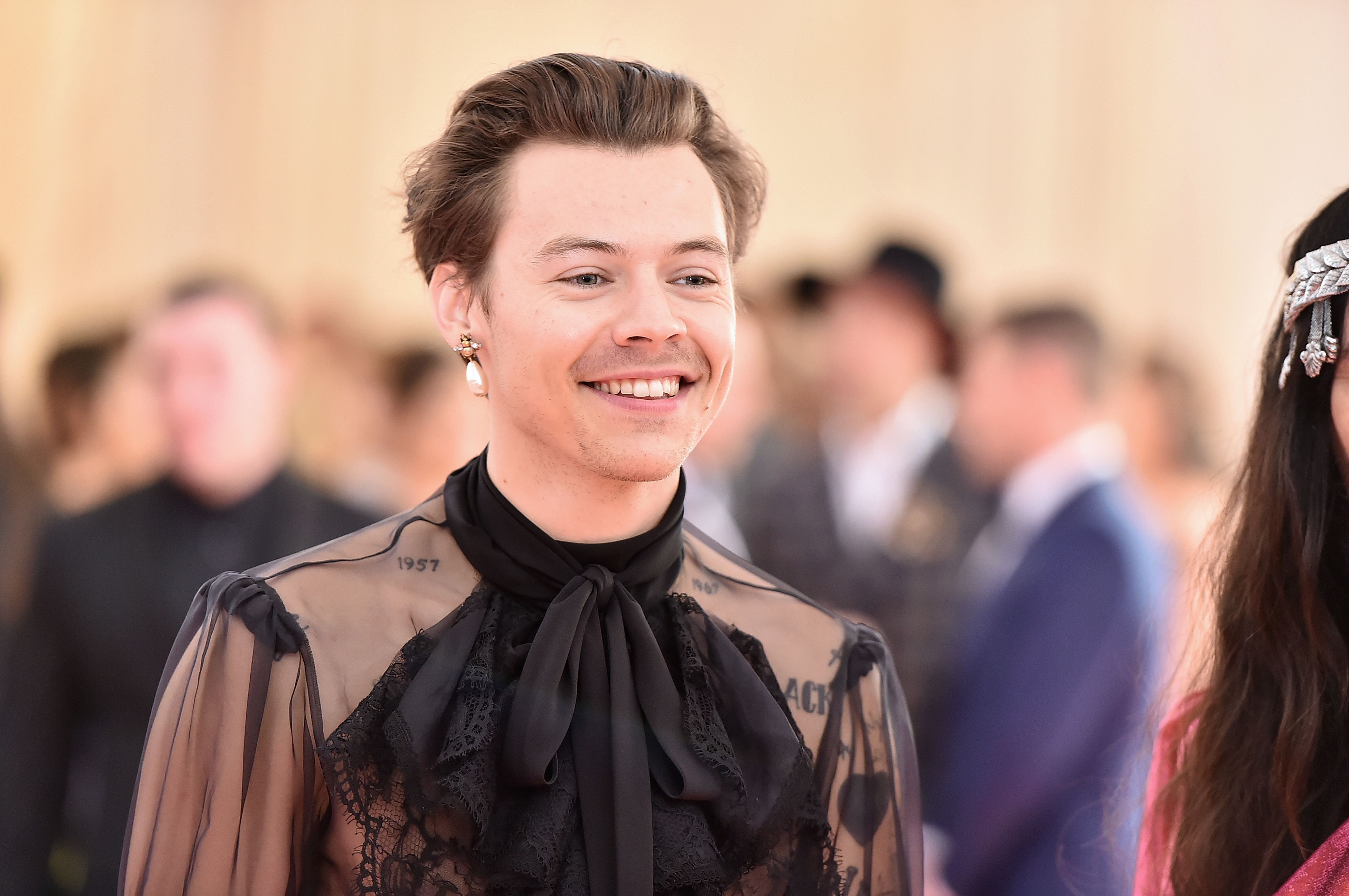 Harry Styles Puts a Rockstar Spin on the Grandpa Sweater Vest  Vogue