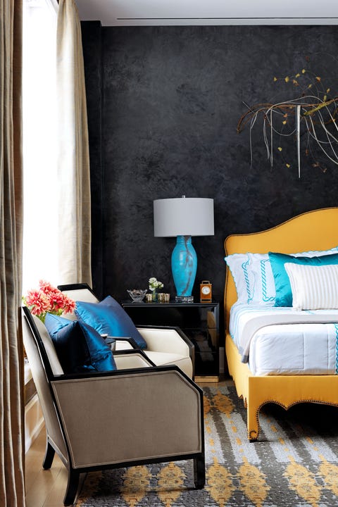 Yellow bed in black bedroom