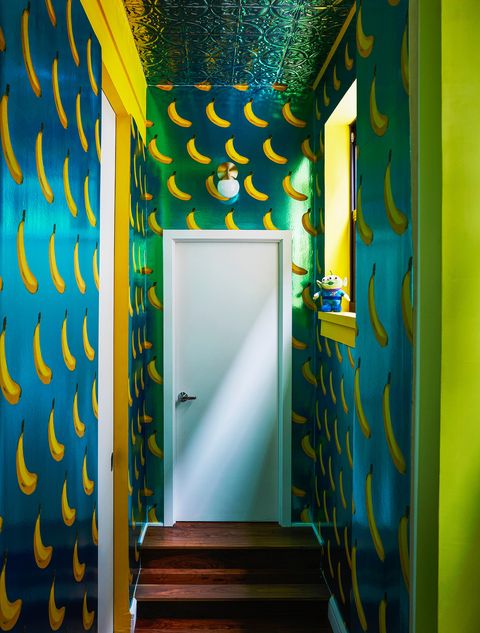 hallway with blue and yellow banana wallpaper