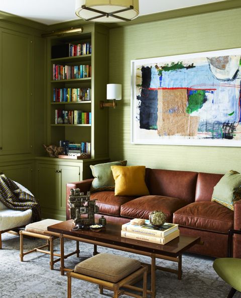 green room with brown leather sofa