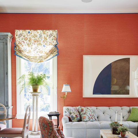 living room, orange wallpaper, white couch