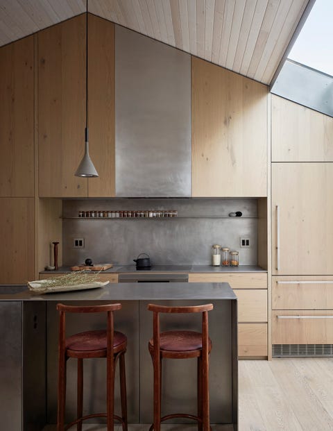 wooden kitchen, wooden bar stools, ceiling lamp