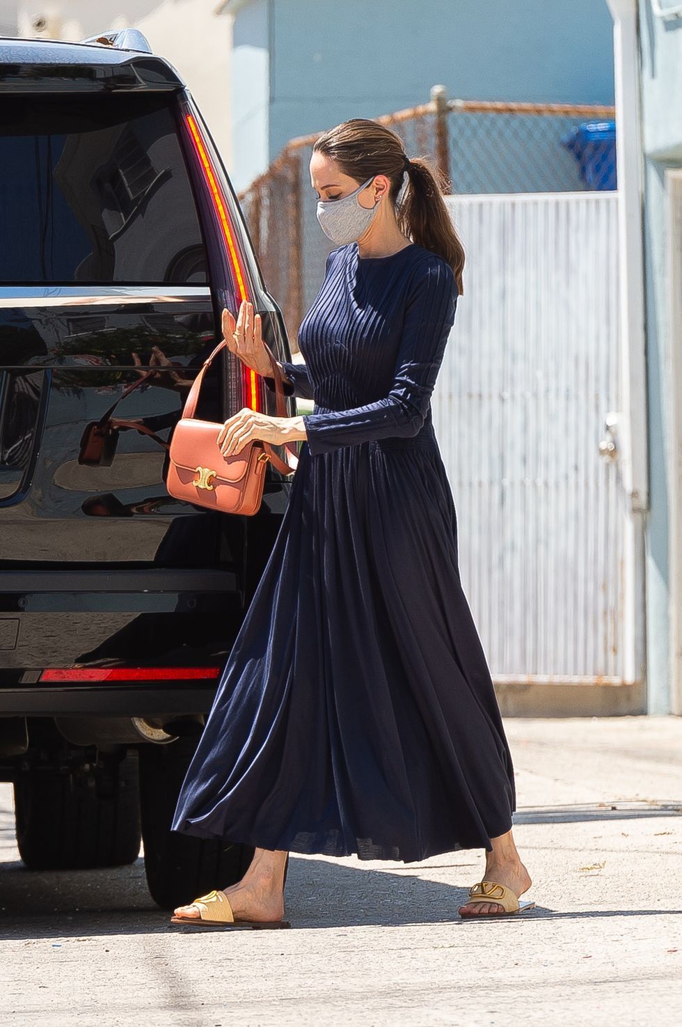 Angelina Jolie Sported A Navy Pleated Dress In Los Angeles