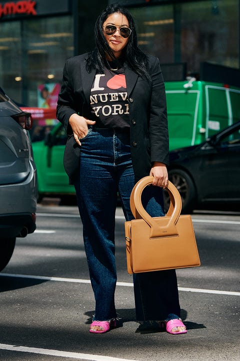 a bazaar editor stands in manhattan wearing a work outfit to illustrate the best work outfit ideas 2022