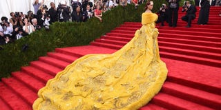 Red carpet, Carpet, Dress, Yellow, Flooring, Fashion, Gown, Tradition, Event, Haute couture, 