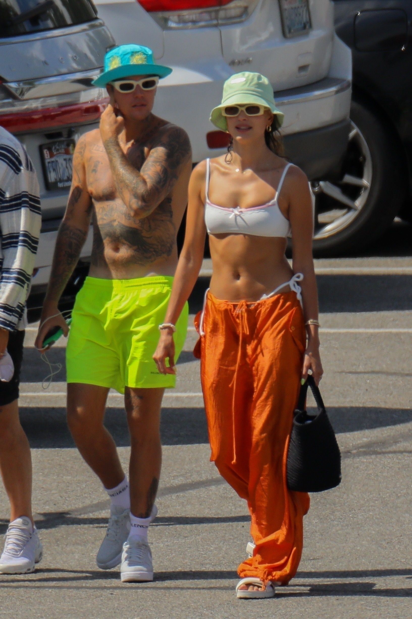 Justin and Hailey Bieber Hang Out on a Lake in Neon Outfits