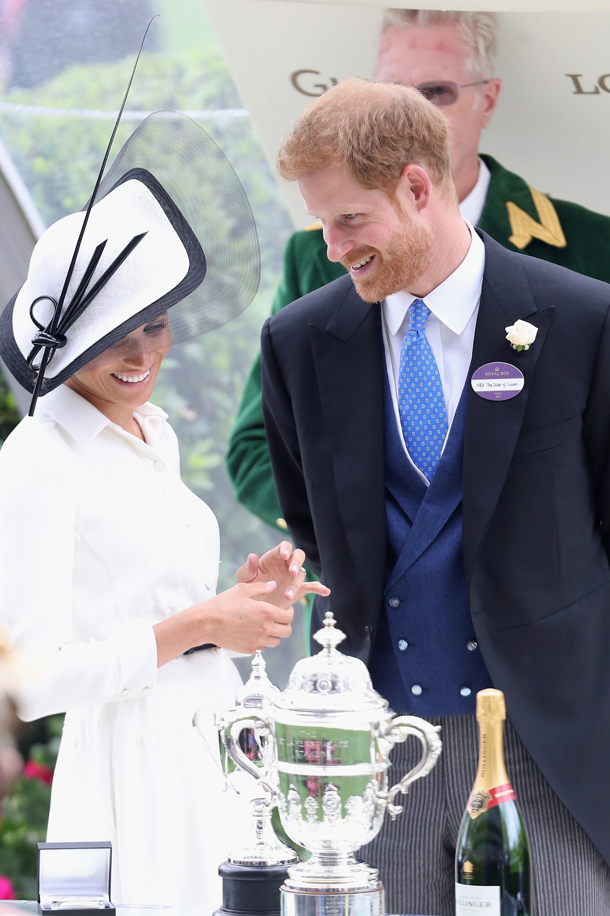 https://hips.hearstapps.com/hmg-prod.s3.amazonaws.com/images/hbz-prince-harry-meghan-markle-cute-moments-2018-06-gettyimages-979403482-1557334671.jpg?crop=1xw:1xh;center,top