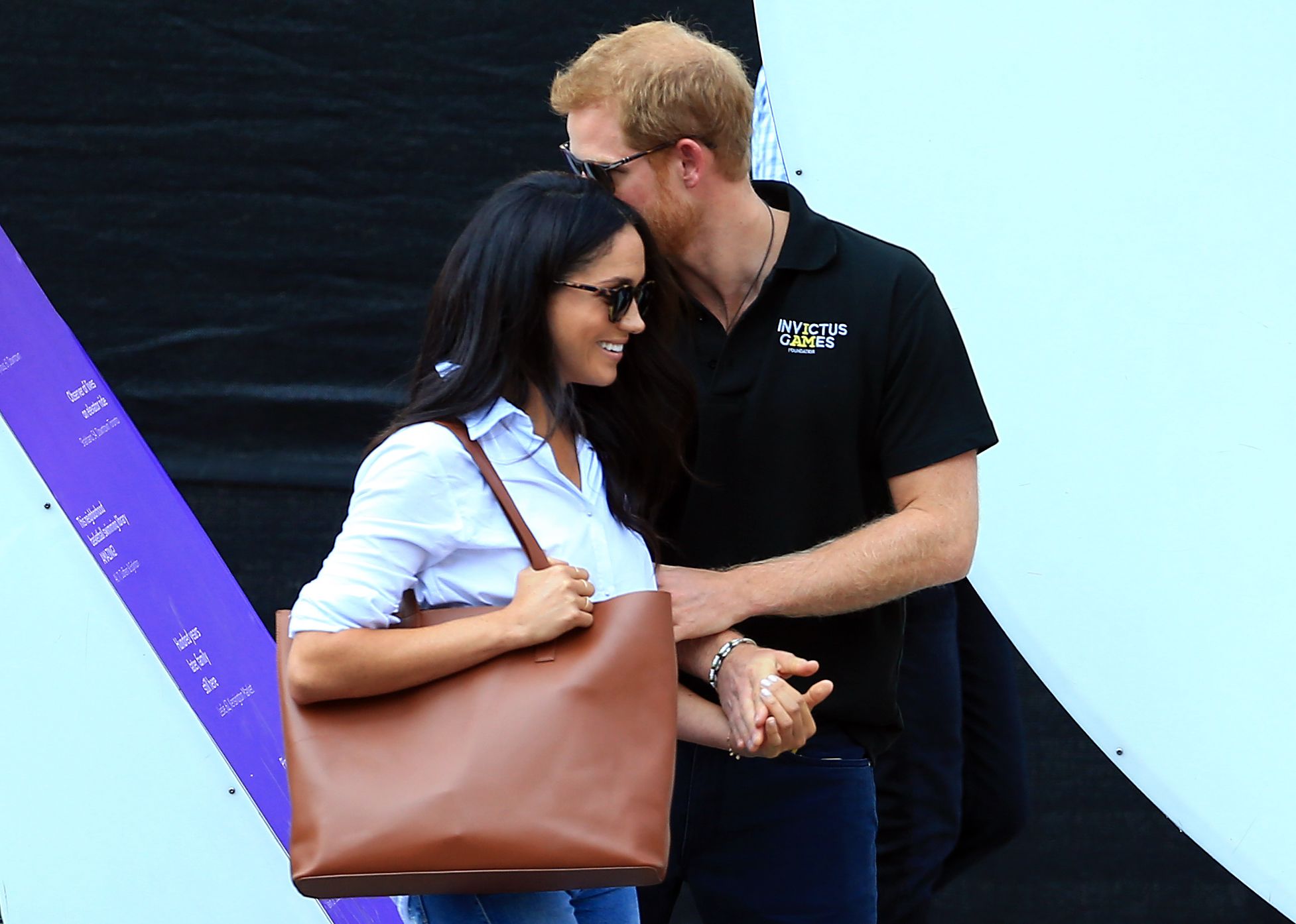 https://hips.hearstapps.com/hmg-prod.s3.amazonaws.com/images/hbz-prince-harry-meghan-markle-cute-moments-gettyimages-853713612-1523378904.jpg?crop=1xw:1xh;center,top