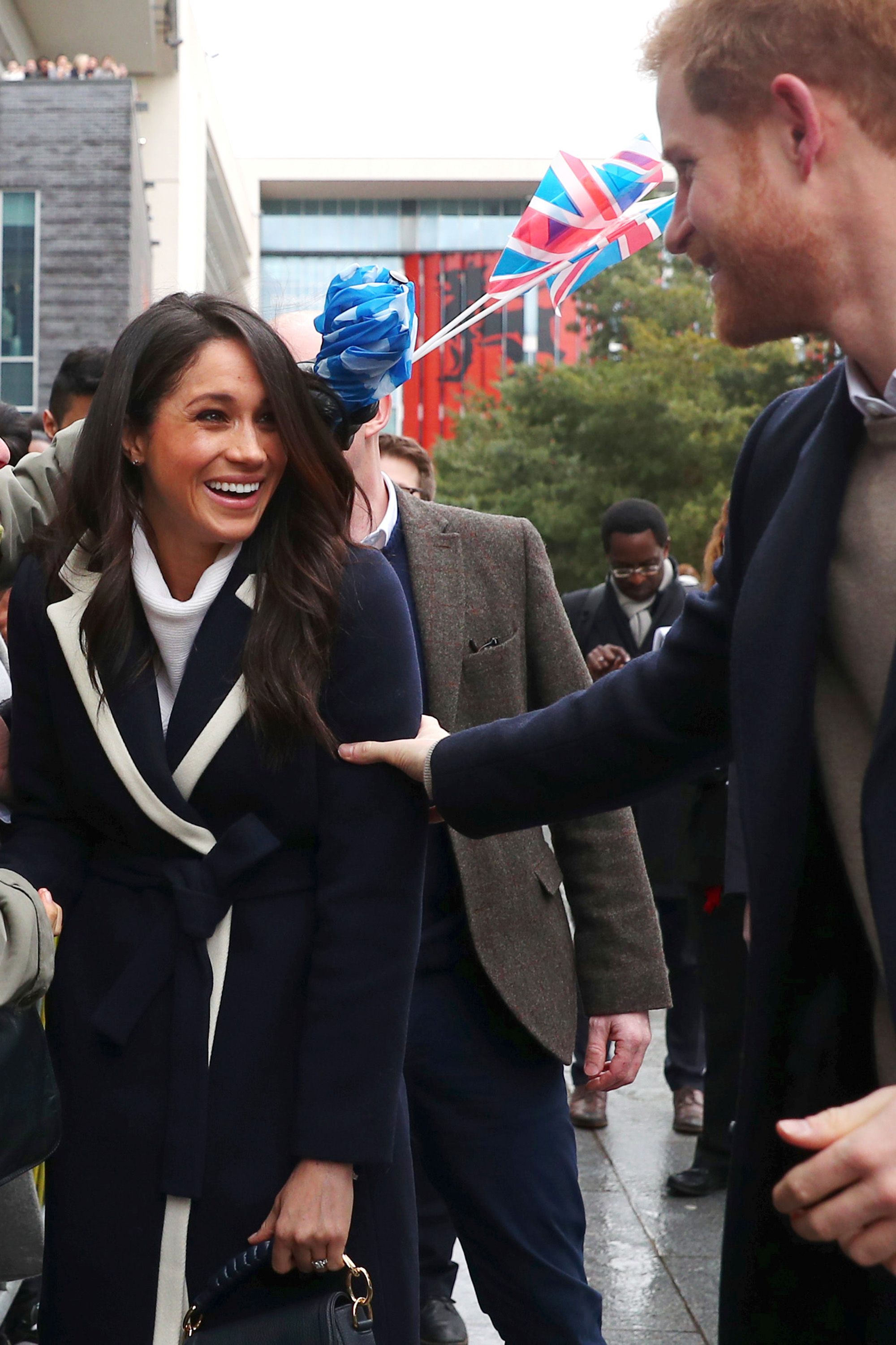 https://hips.hearstapps.com/hmg-prod.s3.amazonaws.com/images/hbz-prince-harry-meghan-markle-cute-moments-gettyimages-929177444-1523378908.jpg?crop=1xw:1xh;center,top