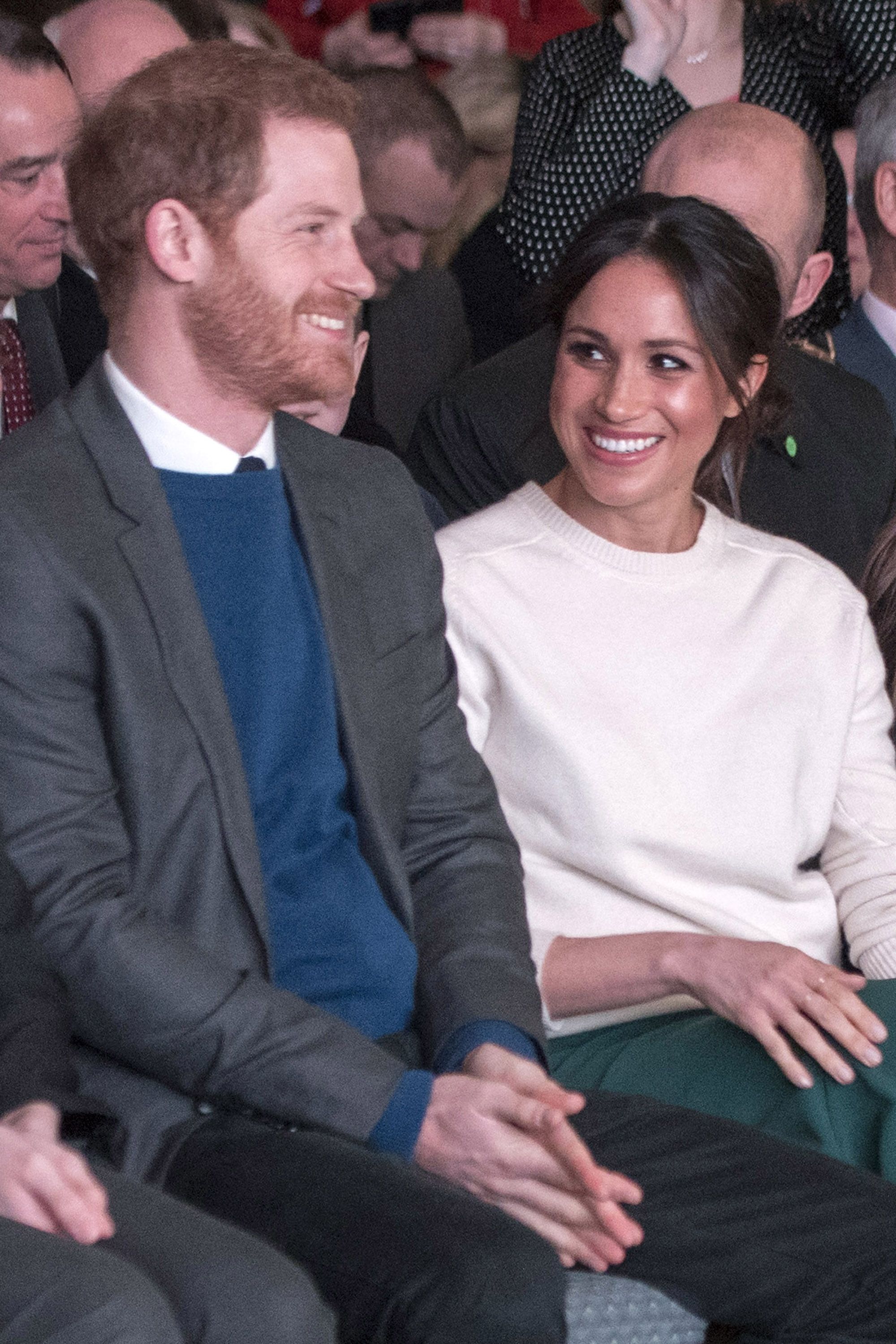https://hips.hearstapps.com/hmg-prod.s3.amazonaws.com/images/hbz-prince-harry-meghan-markle-cute-moments-gettyimages-936896294-1523378909.jpg?crop=1xw:1xh;center,top