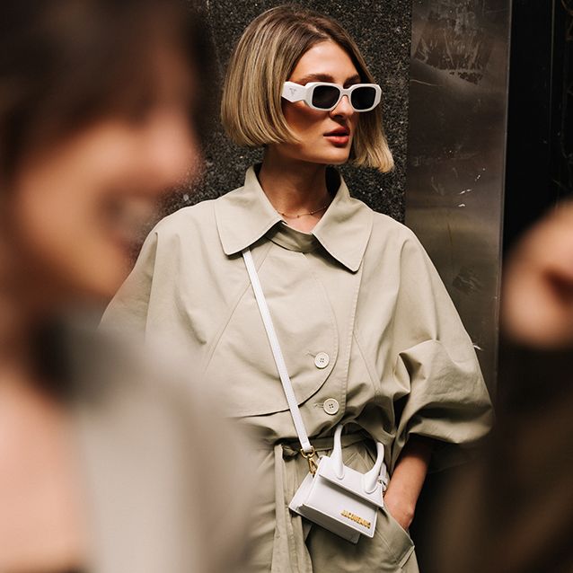 a woman at copenhagen fashion week carries a crossbody jacquemus bag for women to illustrate a roundup of the best crossbody bags for women 2022