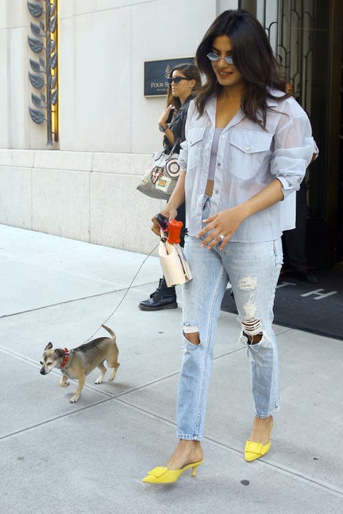 Actress Priyanka Chopra flashes her ring as she leaves her apartment with her dog in New York City, New York on September 5, 2018.