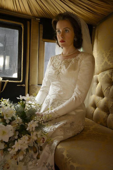 Wedding dress, Dress, Gown, Clothing, Bride, Bridal clothing, Bridal accessory, Sitting, Photography, Flower, 