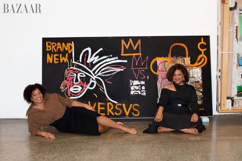 two sisters in front of artwork reframing basquiat