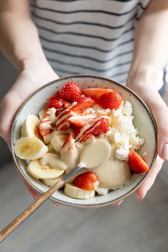 healthy breakfast bowl with cottage cheese, fruits and nut butter