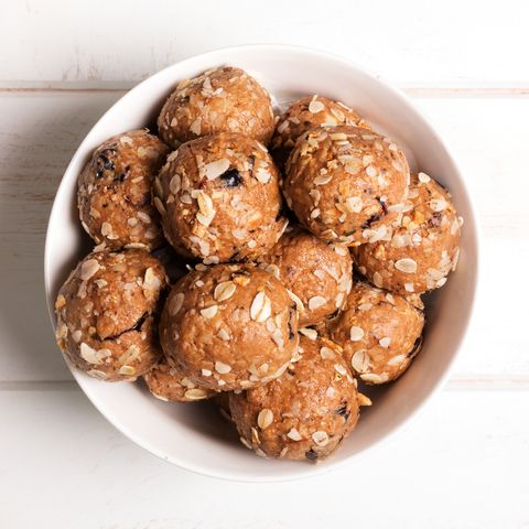 Healthy organic energy granola bolls with nuts, cacao, oats and raisins - vegetarian sweet bites without sugar. Top view