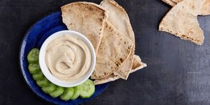 Healthy vegan snack, hummus with pita bread and cucumber