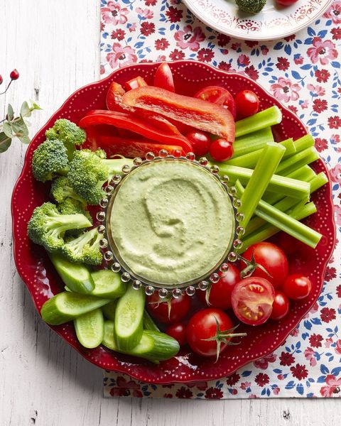 christmas crudites on red platter with green dip